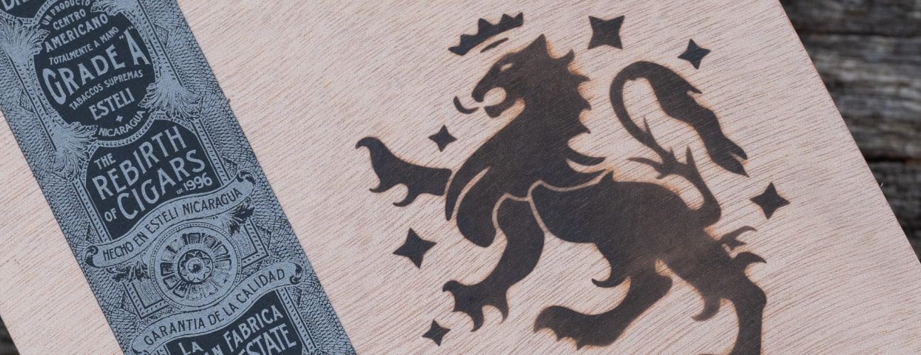 Liga Privada by Drew Estate close up of logo and wrapper of Cigar box showing crowned lion and motto